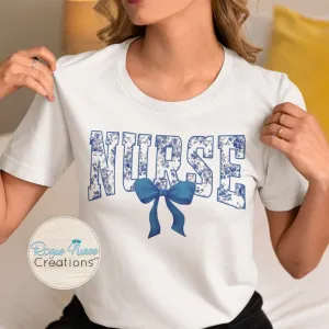 Blue Floral Nurse With Blue Bow Graphic T-shirt, Cute Floral Nurse Shirt, Nurse Gift, flowers and Bow Nurse T-shirt. Pretty Bow Nurse Shirt